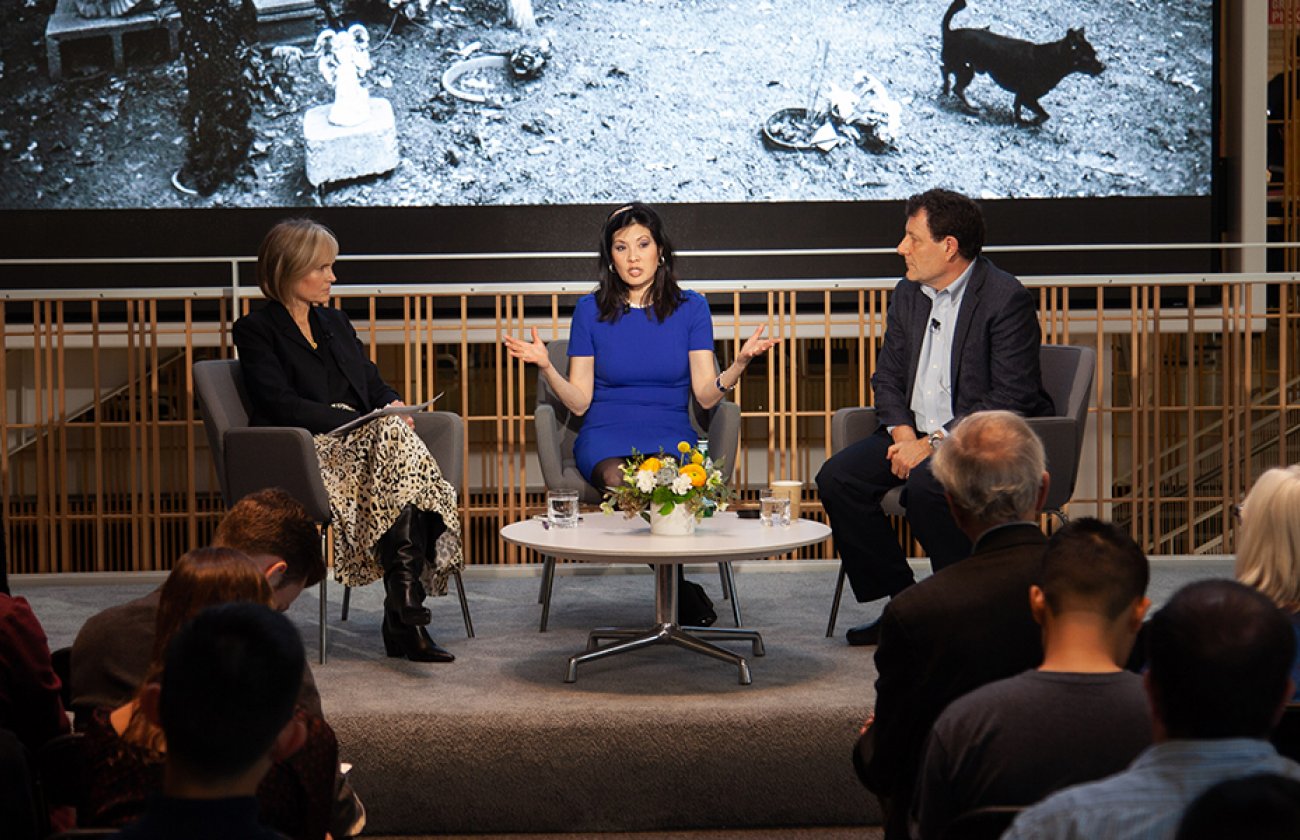Photo of Dean Willow Bay moderating a discussion with Nicholas Kristof and Sheryl WuDunn
