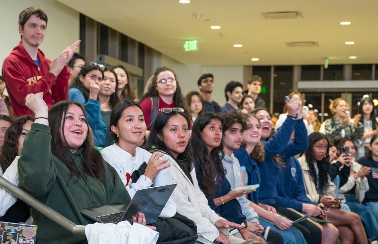 A crowd of students reacting to election results in the USC Annenberg Forum. 