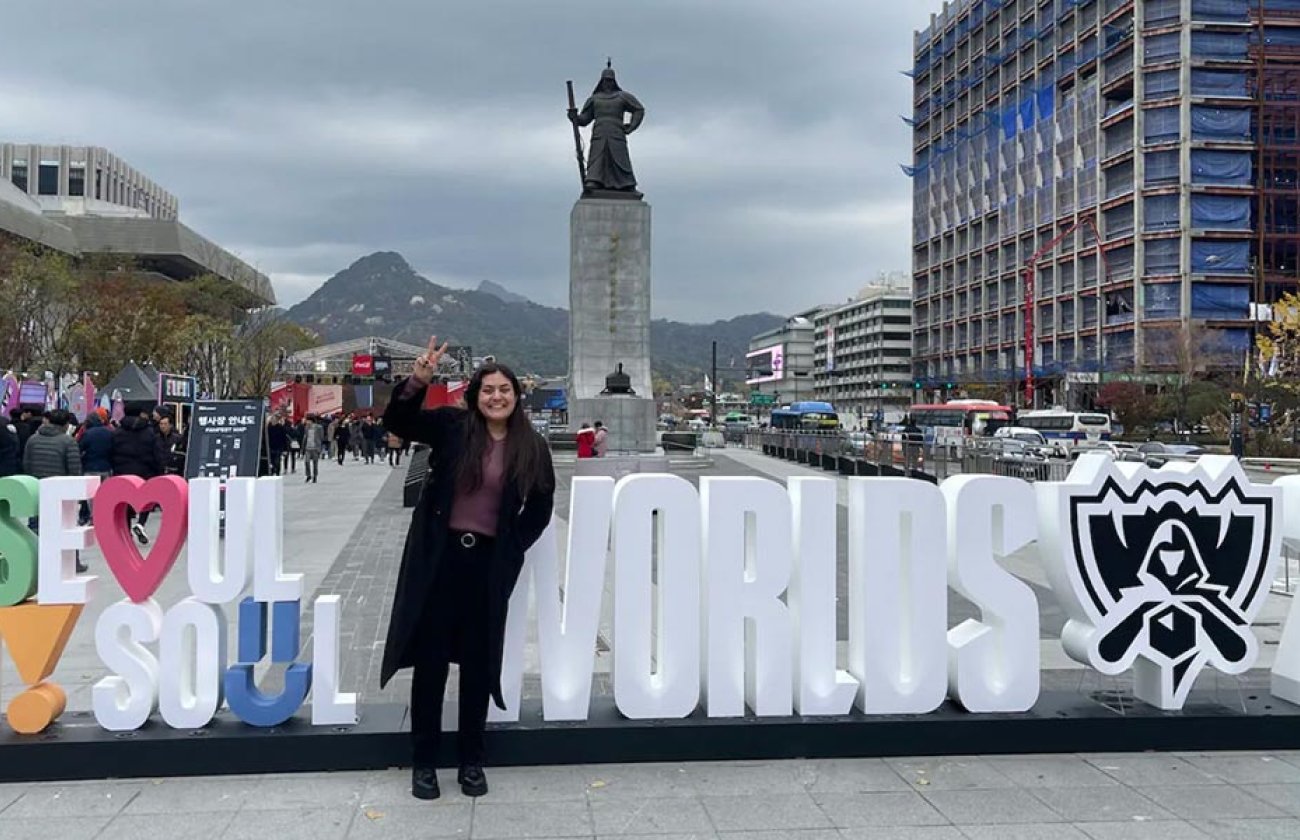 Serena Garcia stands in front of 2023 world gaming sign in Soul, Korea