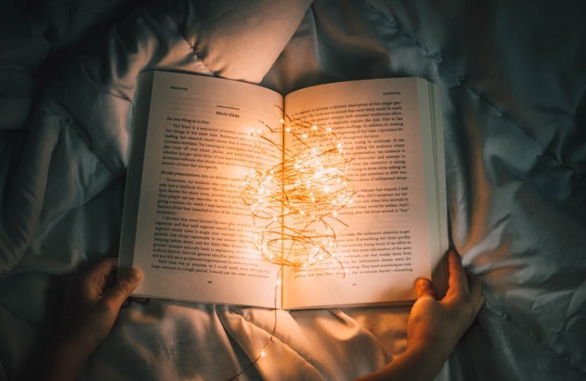 Photo of an open book with a string of lights in it