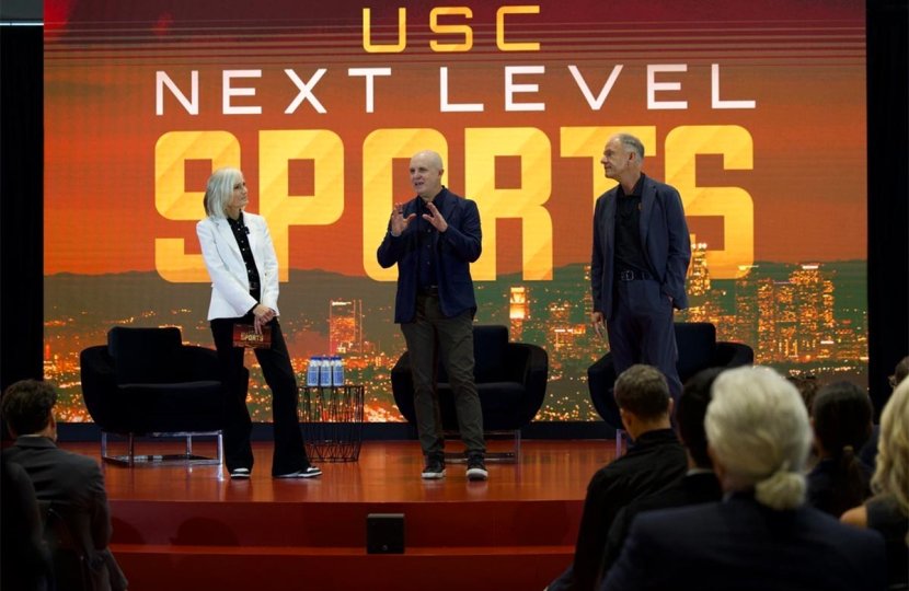 Bloomberg chief correspondent Jason Kelly, center, delivers opening remarks with USC Annenberg Dean Willow Bay and USC Marshall Dean Geoffrey Garrett.
