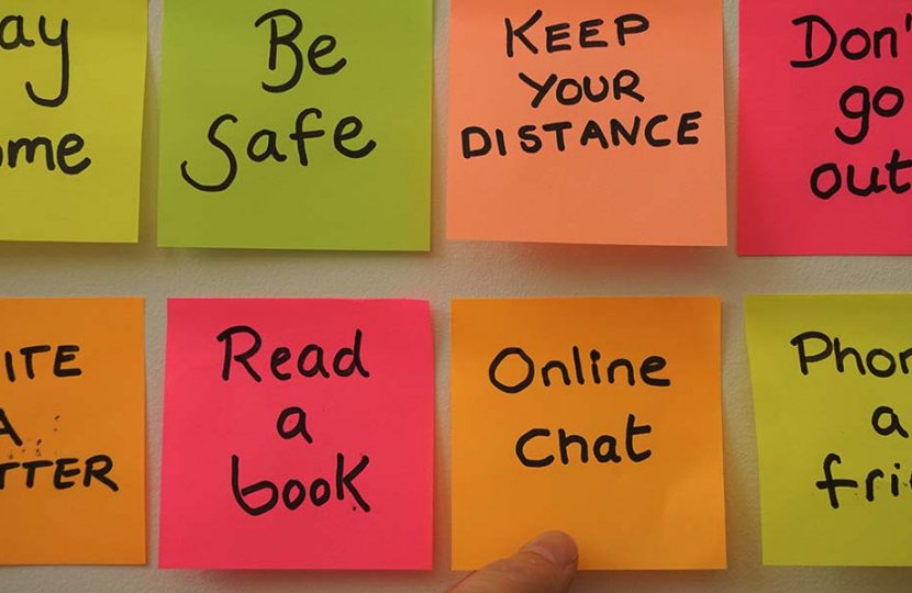 Photo of eight sticky notes that read messages like "online chat", "stay home", and "be safe"
