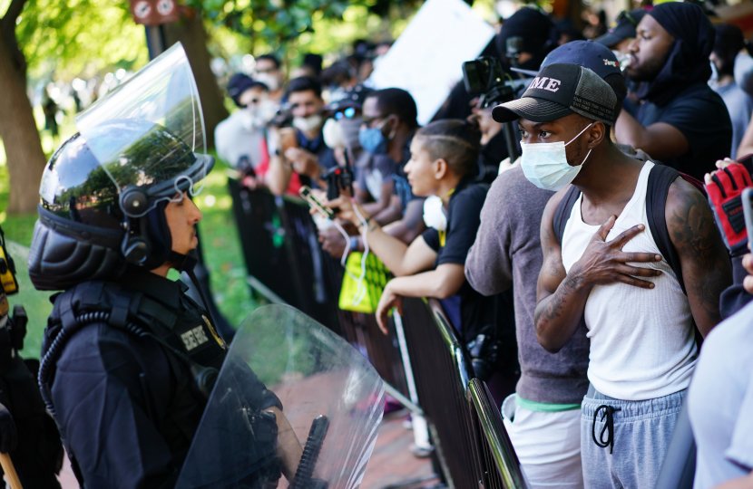 Photo of protesters against racist police violence encountering police 