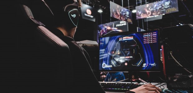 Photo of person playing a game on computer