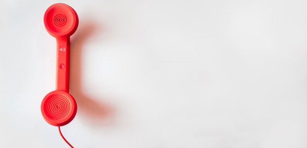 Photo of a red landline telephone