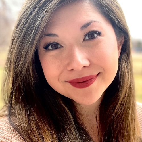 Young woman smiling at camera. 